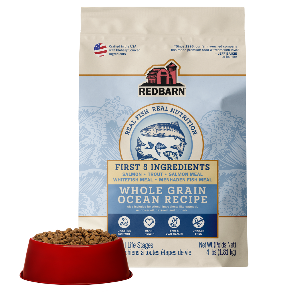 Best Fish Food for dogs. Redbarn Whole Grain Ocean recipe dog food package featuring Salmon, Trout, Salmon Meal, Ocean Fish Meal, Menhaden Fish Meal.