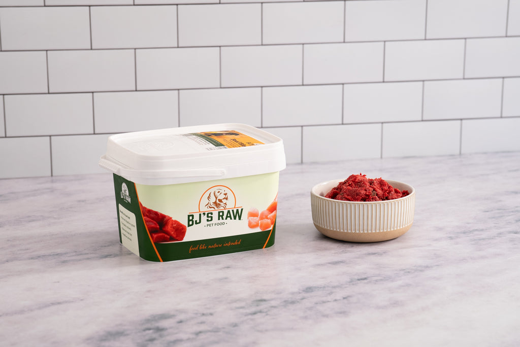 BJ's Beef Blend raw dog food in container with fresh ground beef