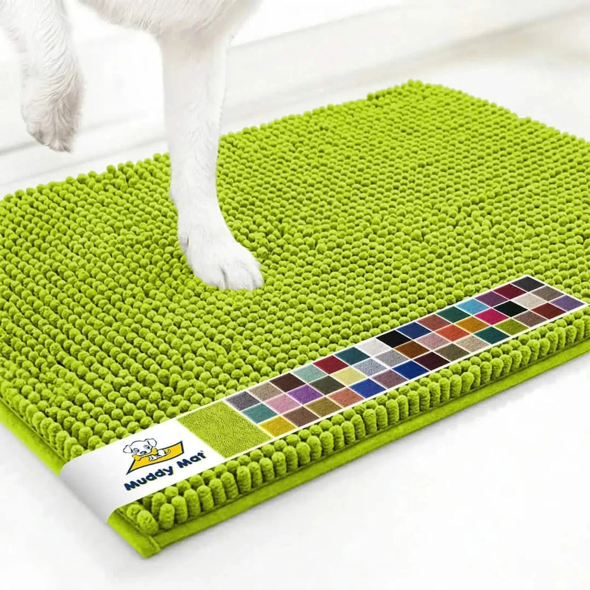 Close-up of Muddy Mat® anti-mud dog door mat in spring green showing chenille nubs and a dog’s paw on a white floor