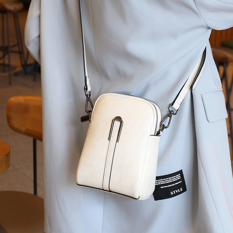 Compact Dome Phone Crossbody Bag with Adjustable Strap, Zip-Around Closure and Pebbled Finish in 6 Colors