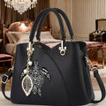 Crossbody Bag with Geometric Turtle Print, Top Handle, Zip Closure, Leaf Charm and Detachable Strap in 2 Colors