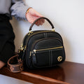 Compact Dome Crossbody Bag with Dual Zip Sections, Top Handle and Wide Patterned Strap in 3 Neutral Colors