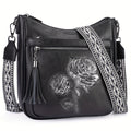 Floral-Embossed Vegan Leather Crossbody Bag with Rose Panel, Tassel Zippers & Wide Patterned Strap